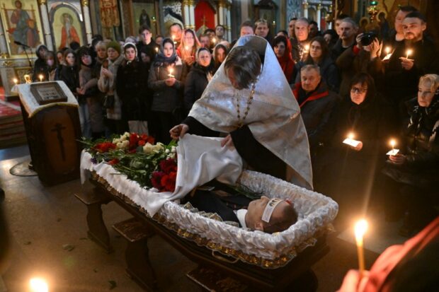 The body of late Russian opposition leader Alexei Navalny is seen during the funeral service 